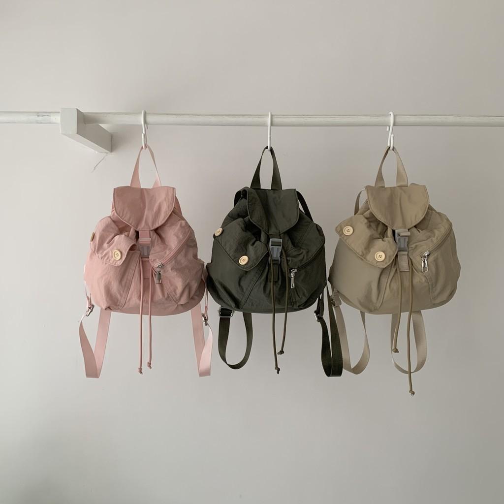 IELGY new Korean niche design outdoor pocket button drawstring double shoulder nylon backpack