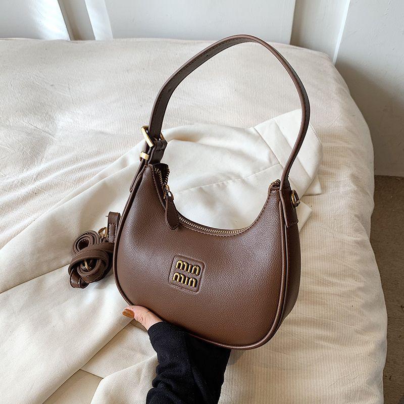 

Retro bag women 2025 new crescent moon bag dumpling bag commuter black messenger bag hand carry armpit bag