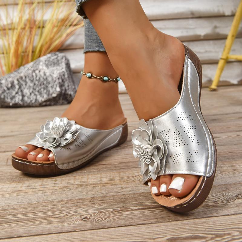 

Thick-soled hollowed-out one-word slippers women s open-toed flower slope heel beach cool slippers 36 серебряный