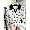 Women's polo shirt, long-sleeved, black contrasting lapels, small flowers and dots