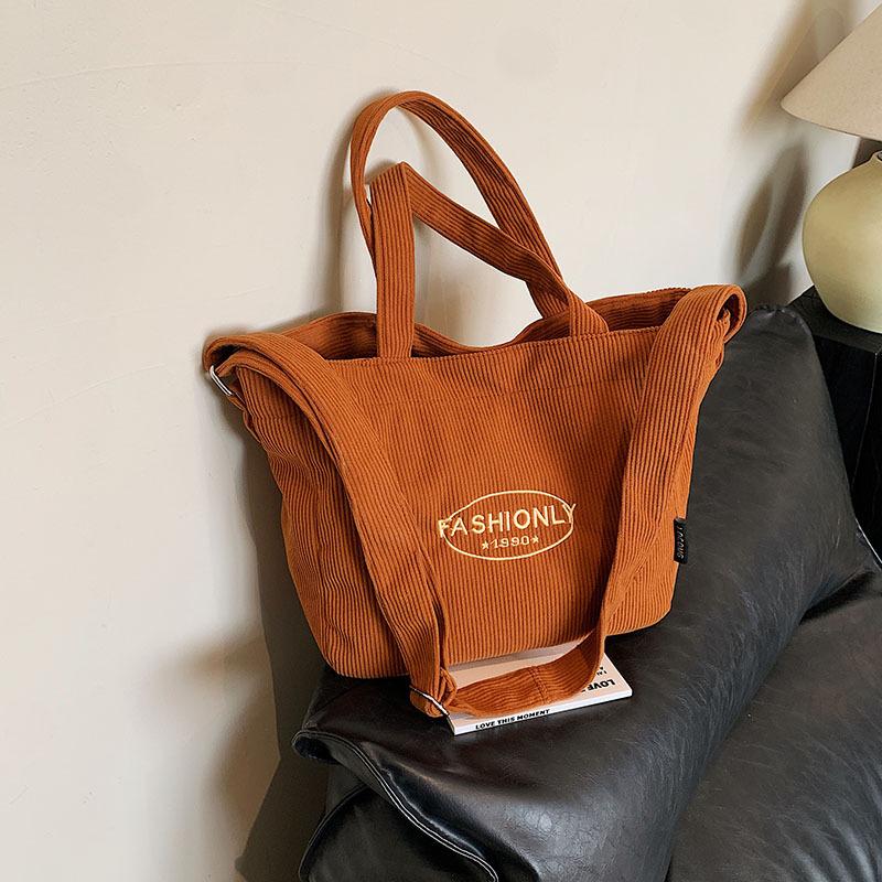 

Нішевий дизайн сумка великої місткості жіноча 2024 зима нова смуга оксамит портативна сумка-тоут студентська сумка через плече месенджер коричневий