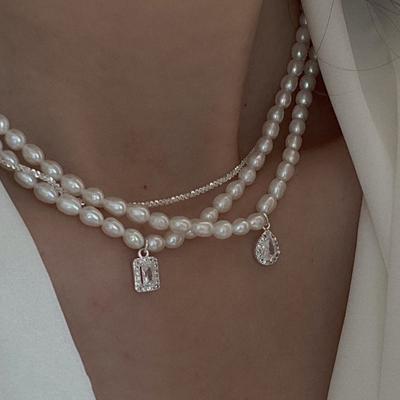 Chaîne de cou polyvalente coréenne Chaîne de clavicule Rétro français Zircon goutte d'eau Collier de perles d'eau douce