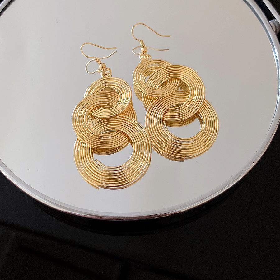 

European and American metal round hollow fringed ear hook fashionable personality cold wind exaggerated earrings light luxury high-end earrings