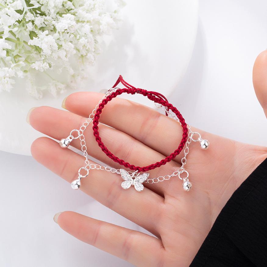 

Двухслойный плетеный браслет из красной веревки с подвеской-колокольчиком в виде бабочки