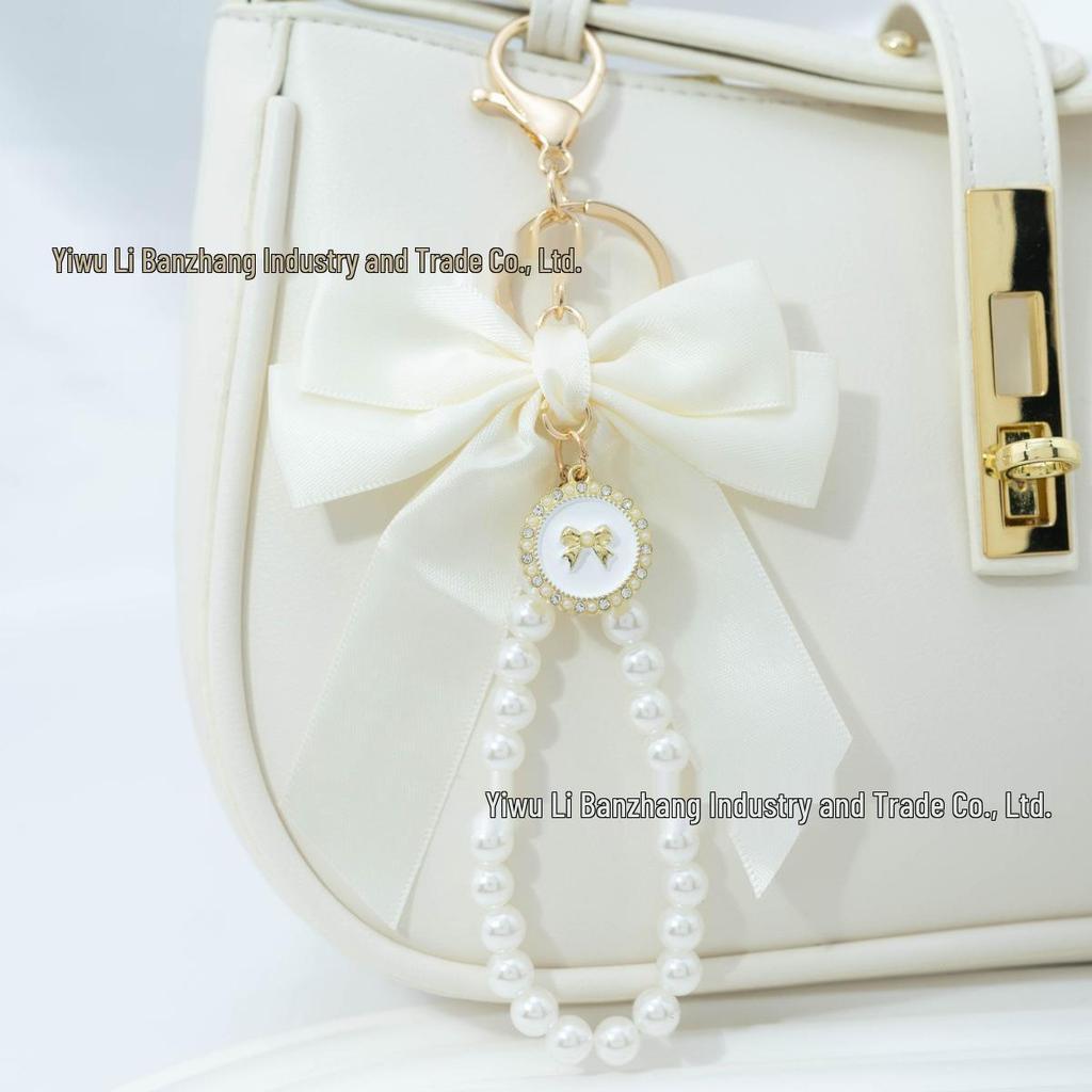 Large Bow Faux Pearl Bracelet Keychain with Colored Woven Strap and Alloy Tag Pendant
