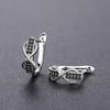 Infinity Design Huggie Hoop Earrings for Women with Black Stone Accents Silver Tone Earrings for Daily and Night Out