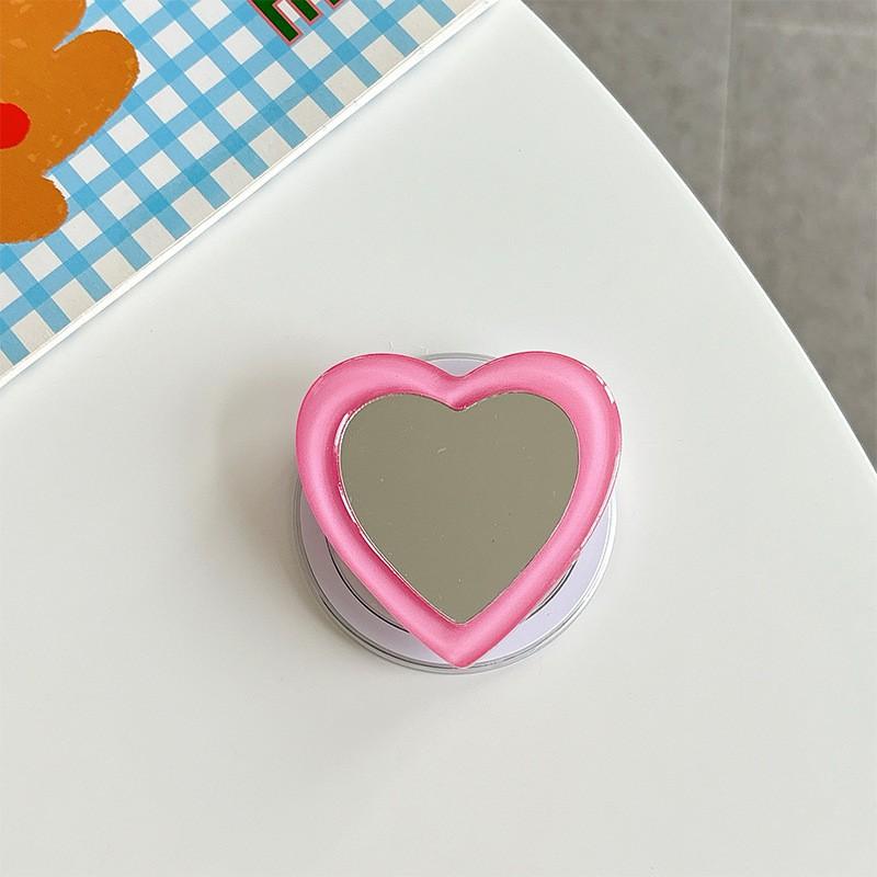 

Solid Color Heart-shaped Mirror Korean Phone Holder Airbag Retractable Folding Magnetic Suction Lazy Desktop Support Ring Wholesale
