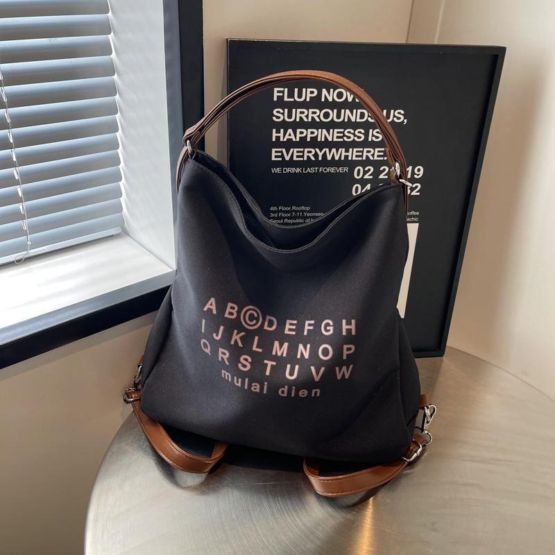 

Autumn new canvas large-capacity bag women s 2025 fashion messenger bag fashion texture commuter shoulder tote bag чорний