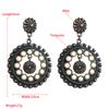 Retro Ethnic Style Earrings with Hollow Round Pendants and Exaggerated Party-style Ear Accessories
