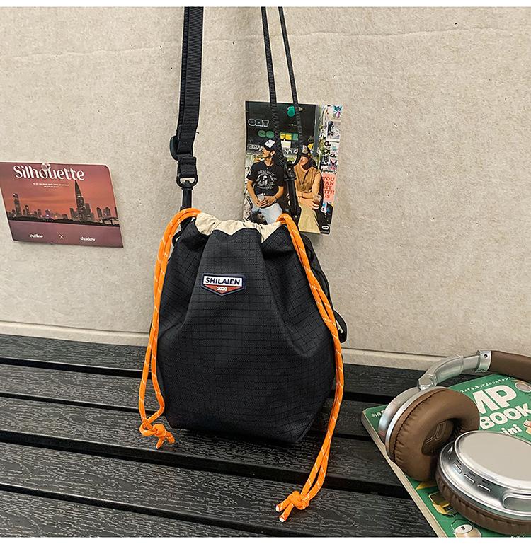 Tide brand messenger bag, men's and women's outdoor sports, girls' drawstring, bundle, color matching, one-shoulder small bucket backpack.