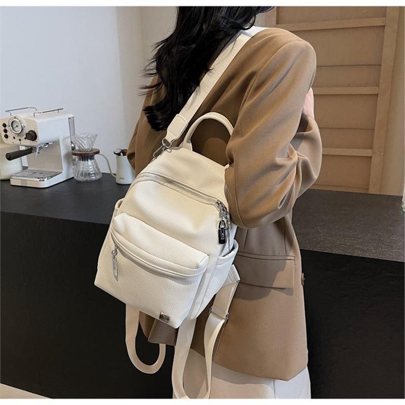 Schoolbag large capacity 1011 new casual versatile backpack portable single shoulder three-purpose schoolbag going out backpack