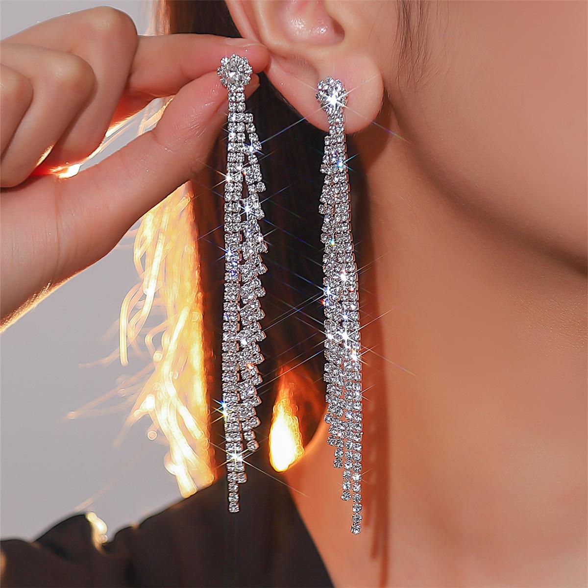 

Women s long fringed earrings full of diamonds срібний