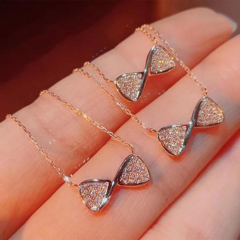 18K Gold Bow Diamond Necklace: Exquisite, Versatile, Light Luxury Clavicle Chain with Heart Pendant.