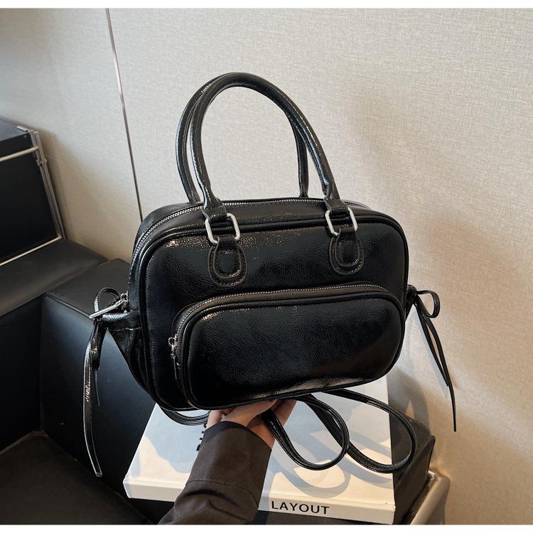 Niche design bag new fashion casual backpack women's hand retro shoulder pillow bag