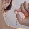 Clipsuri de urechi elegante cu strasuri în formă de ochi de pisică și ciucuri – Nu necesită perforare