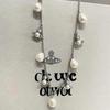 Empress Dowager Baroque Tassel Pearl Necklace - Women's Fashion Statement