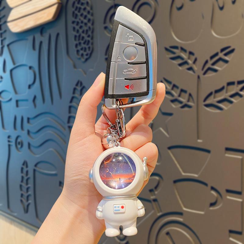 Creative Astronaut Starry Sky Keychain Pendant: Cartoon Doll Schoolbag Decoration, Perfect for Students or Couples.