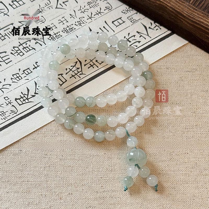 Golden Silk Jade Bracelet: Women's Xinjiang Tianshan Green Jade with Floating Flower Design and Barrel Beads.