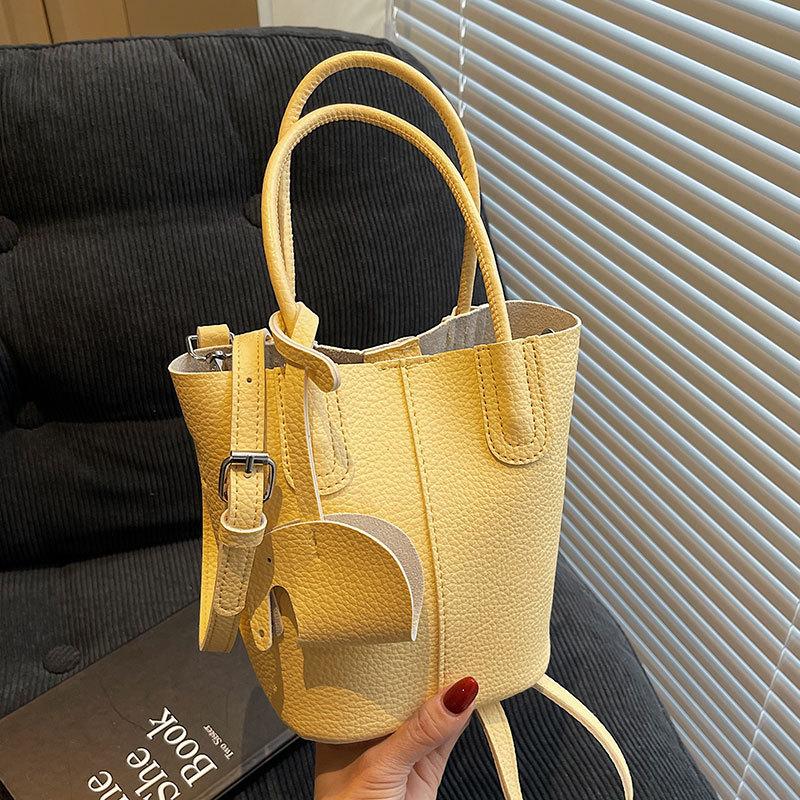 Popular Korean Simple Style Temperament Portable Bucket Bag Women's High-end Lychee Pattern Commuting Versatile Messenger Bag