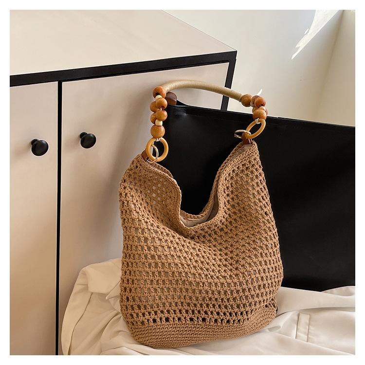 

Woven bag women s summer new shoulder seaside vacation beach bag literary hollow tote bag хаки