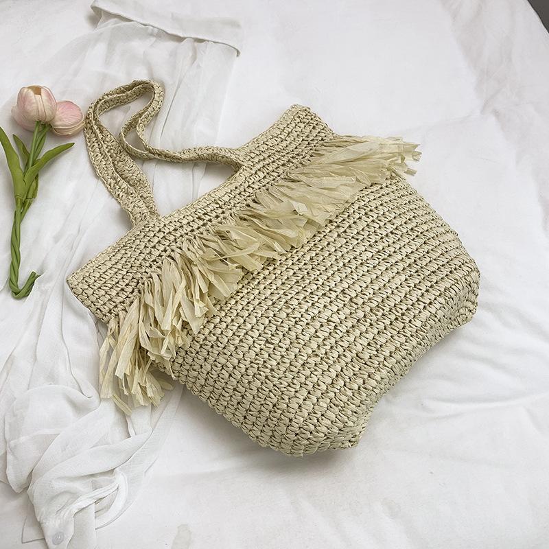 

New straw woven bag women s fringed niche woven bag shoulder bag large capacity seaside beach vacation tote bag