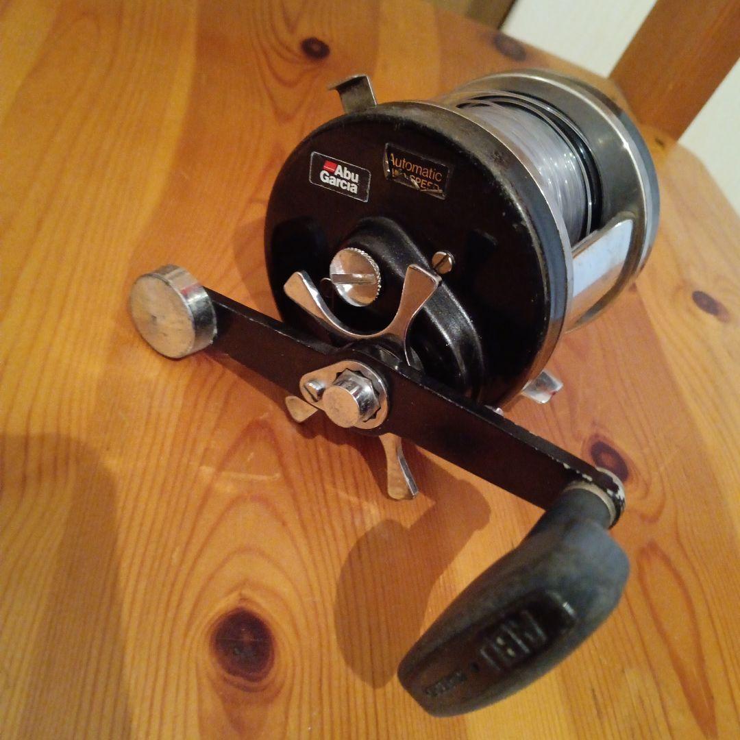 Used Abu Garcia automatic reel with transparent line