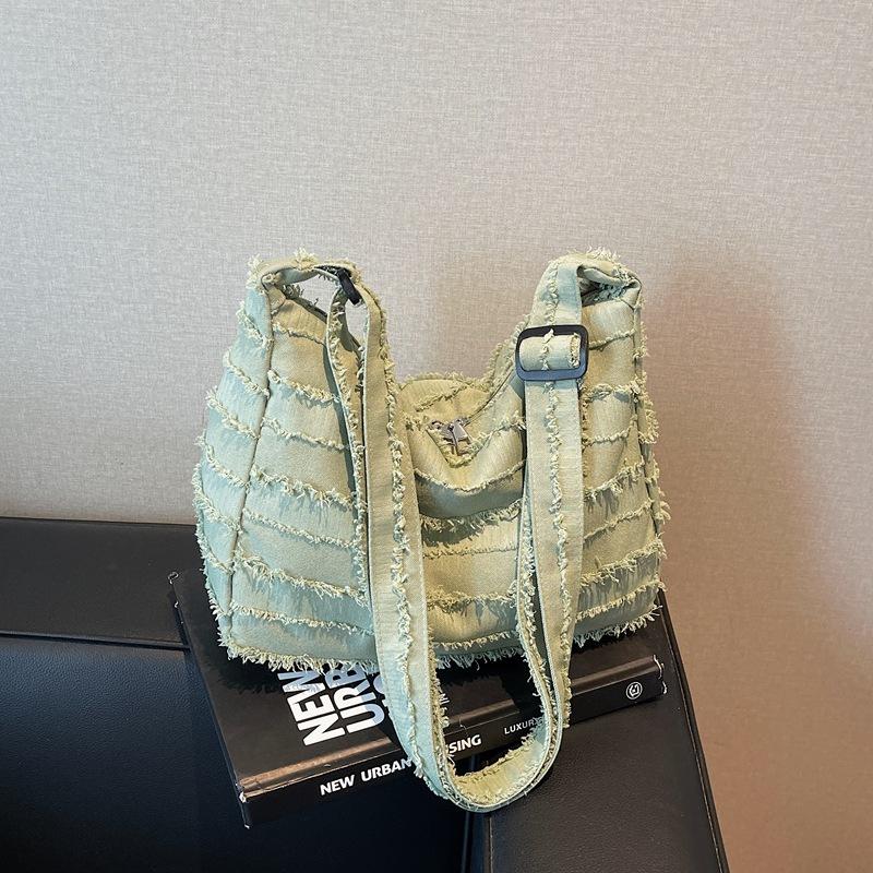 

Large capacity canvas tote bag women s 2025 new niche shoulder bag fashion portable school bag