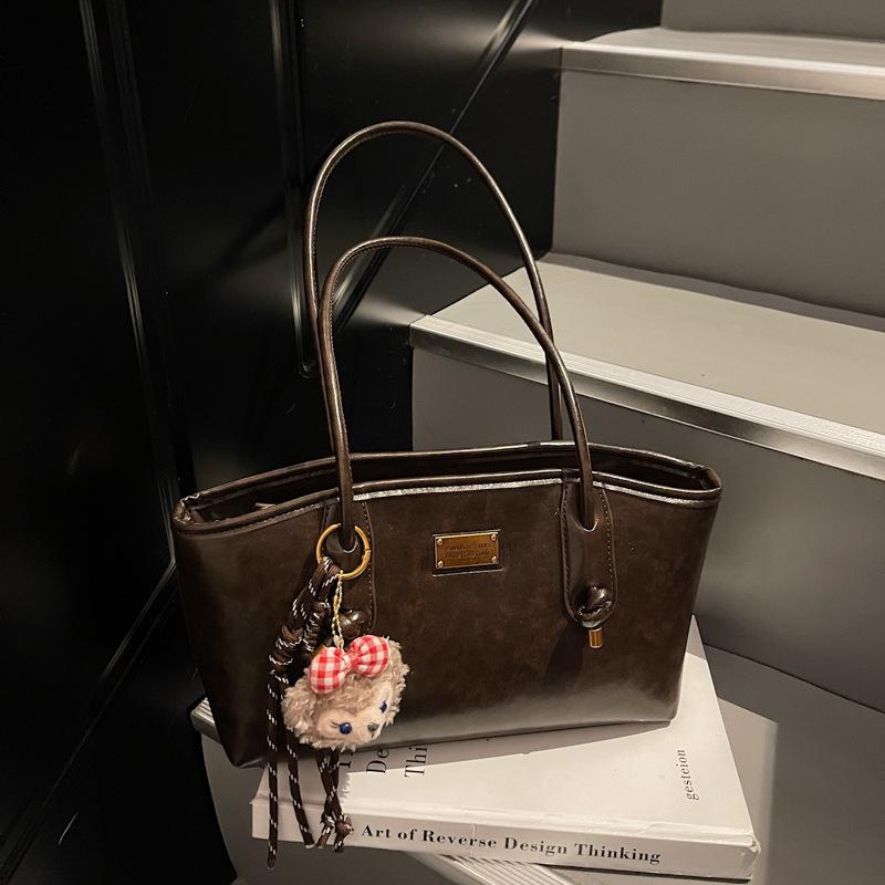 Herbst und Winter neue High-End-Textur Retro Nischen-Tasche Damen College-Studentin Pendeln Schulter-Tragetasche