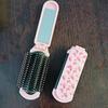 Portable Folding Air Cushion Brush with Mirror in Pink, Pocket-Size Comb for Scalp Massage & Styling