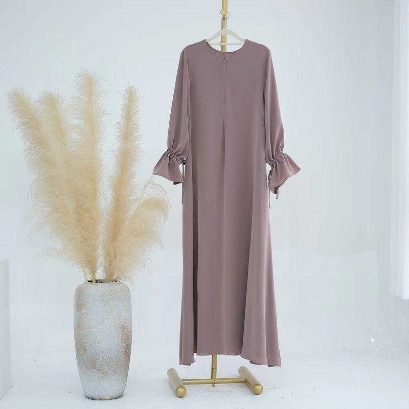 

Middle East Dubai Solid round Neck Bell Sleeve Dress Solid Color Flared Sleeve Dress Lotus root powder color S