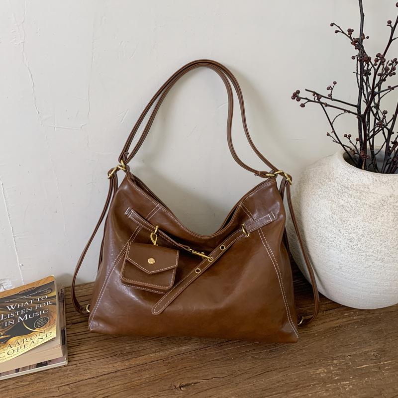 

Retro niche large-capacity backpack bag women s 2025 autumn and winter new multi-purpose shoulder messenger bag tote bag коричневый