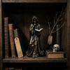 Tabletop Resin Sculpture with Hooded Character, Open Spell Book, and Bronze Style Finish for Shelf Display Use