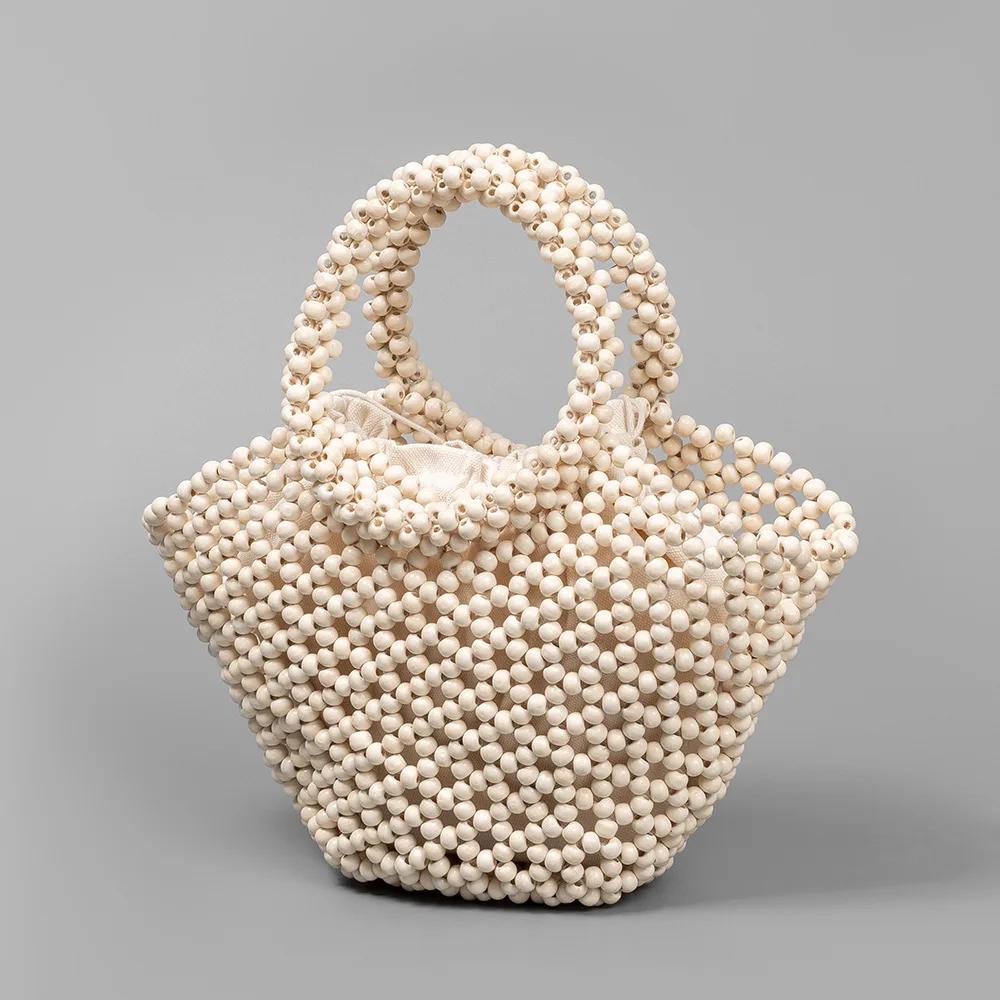 

Handmade Weaved Beach Bag Bohemian Style Wooden Bead Tote Openwork Shoulder Bag for Women Summer Vacation Beachwear Accessory 13x7x18cm молочный белый