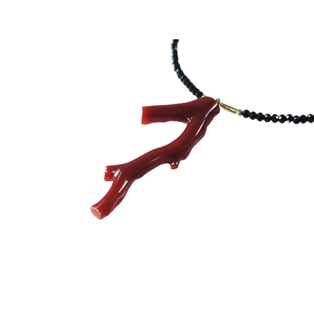 

This 48cm 18k yellow gold pendant features undyed coral from Kochi The pendant features a black spinel and 18k yellow gold long, blood-red Prefecture,