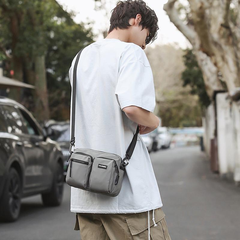 Outdoor leisure multi-pocket canvas messenger bag women's and men's simple travel nylon single shoulder small square bag