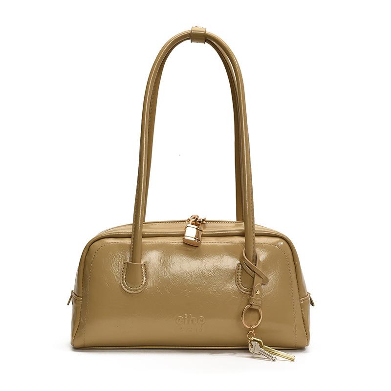 Simple retro bag women's new fashion niche shoulder armpit bag high-end commuter baguette bag