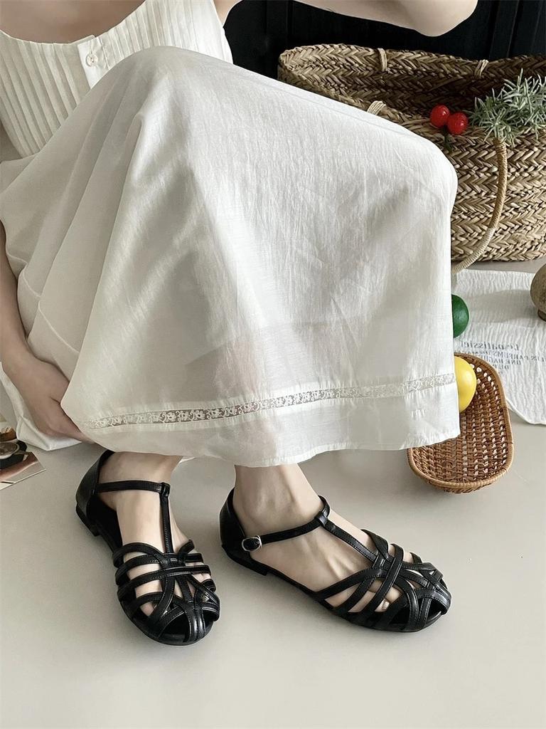 Mori women's woven hollow flat-bottomed bag head sandals women's summer new bohemian one-word strap Roman shoes genuine leather