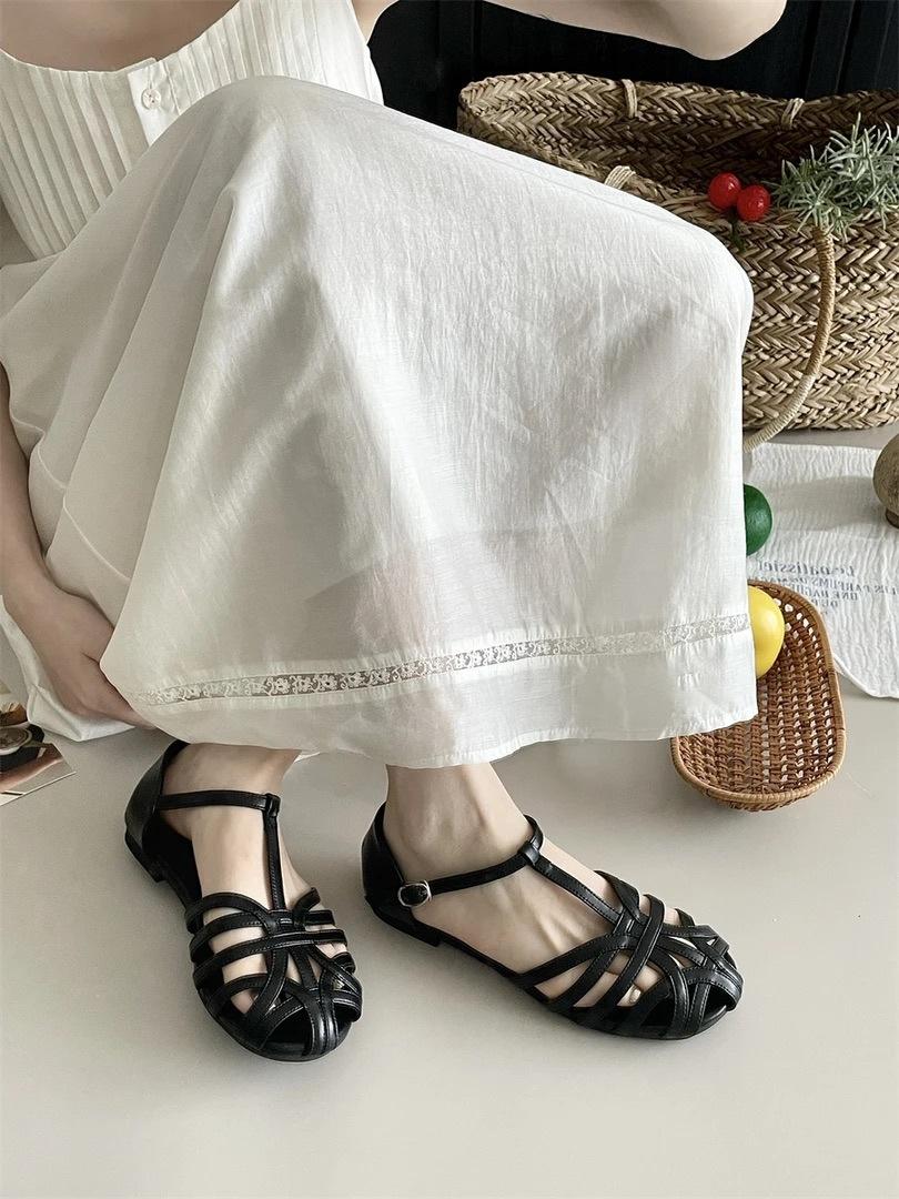 

Mori women s woven hollow flat-bottomed bag head sandals women s summer new bohemian one-word strap Roman shoes genuine leather 40 чорний