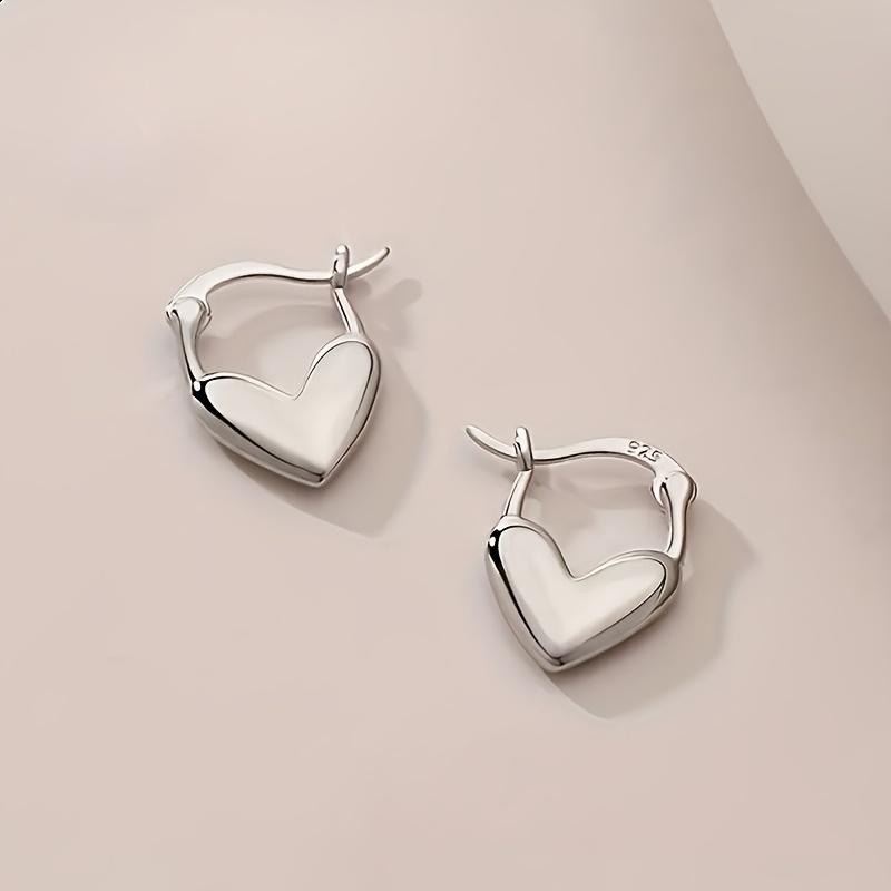 A Pair of Silver Heart-shaped Earrings, Unisex Bohemian Retro Style, Love Themed Jewelry, A Perfect Gift Accessory for Versatile Temperament.