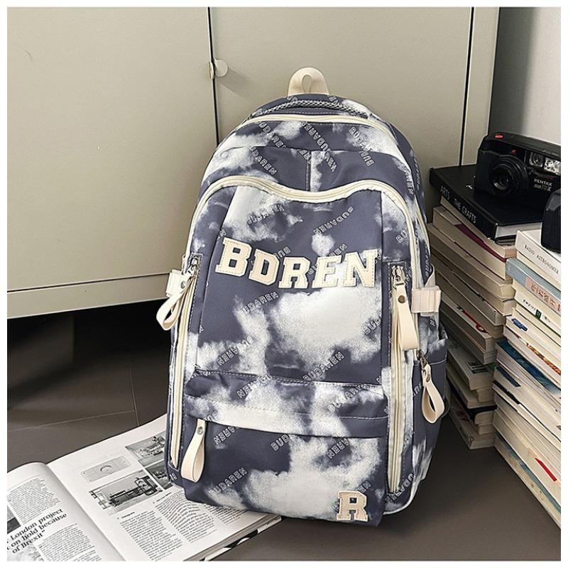 The new schoolbag is high-value, fresh and sweet, literary tie-dye backpack, couple contrasting colors, light travel backpack.
