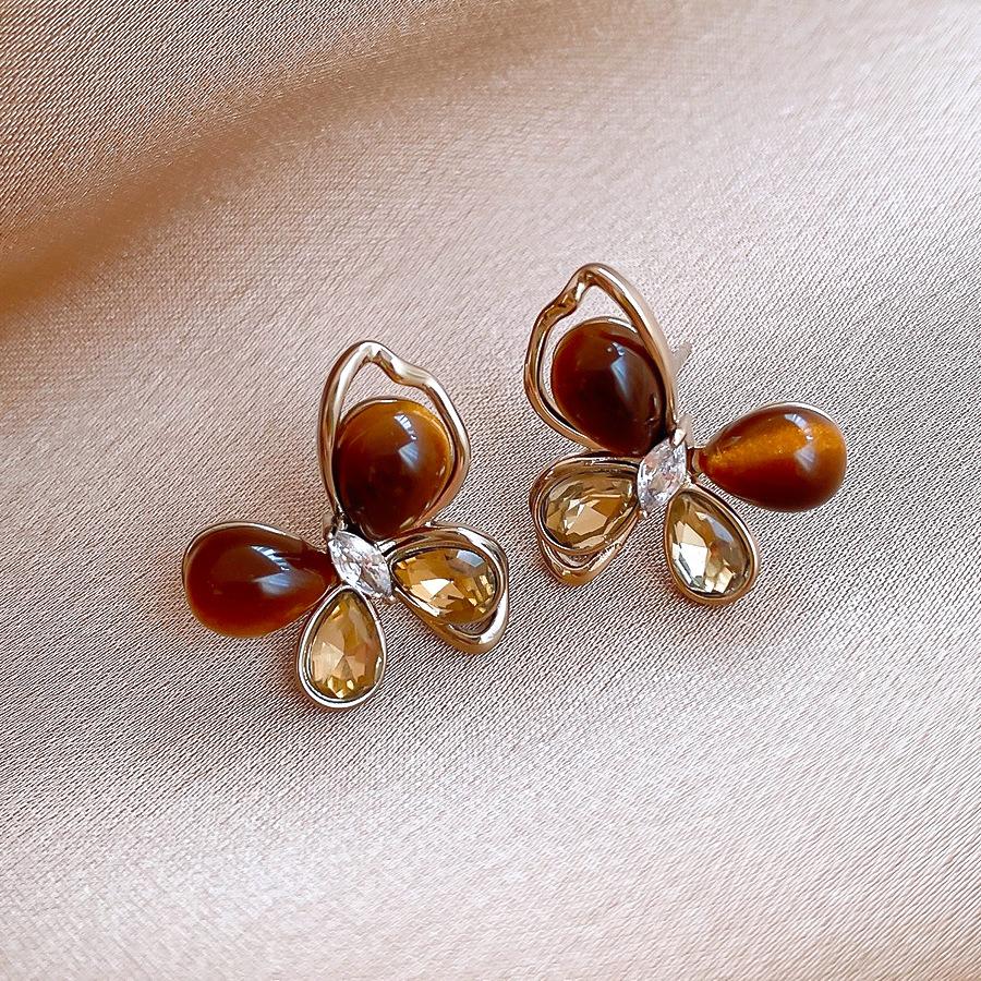 Silver needle zircon imitation tiger s eye stone butterfly stud earrings autumn and winter retro earrings design sense niche