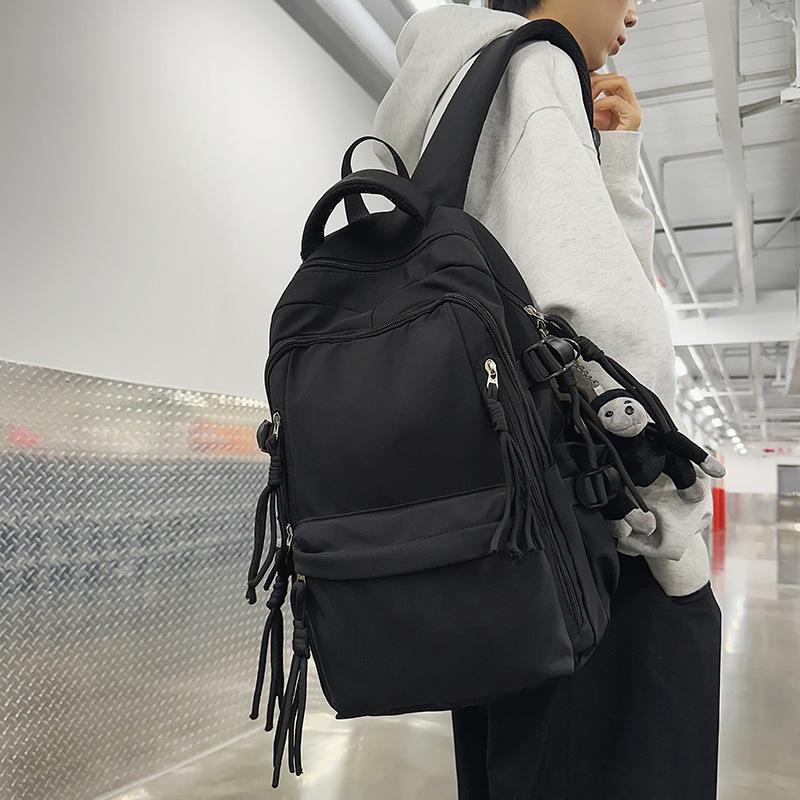 Ryggsäck för män i enfärgat utförande Ryggsäck för kvinnor med flera fickor Stor kapacitet Student Skolväska