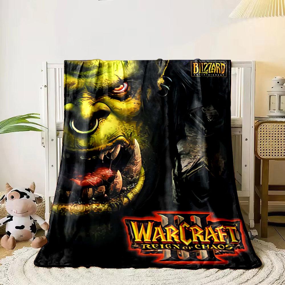 A fierce green orc with sharp teeth, glowing eyes, and Blizzard branding. for all seasons blanket lunch break throw gift 80cm x 120cm