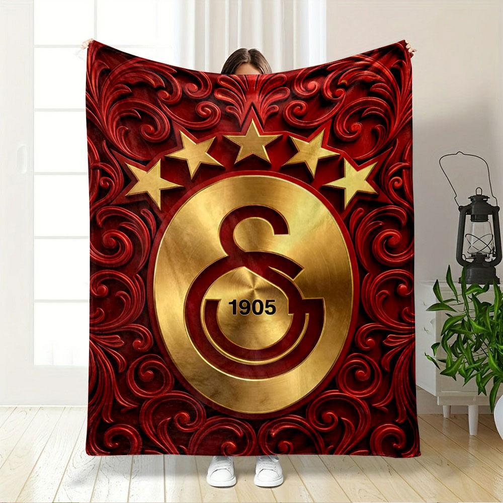 Golden emblem with "1905" and stars, surrounded by red floral patterns. for all seasons blanket lunch break throw gift