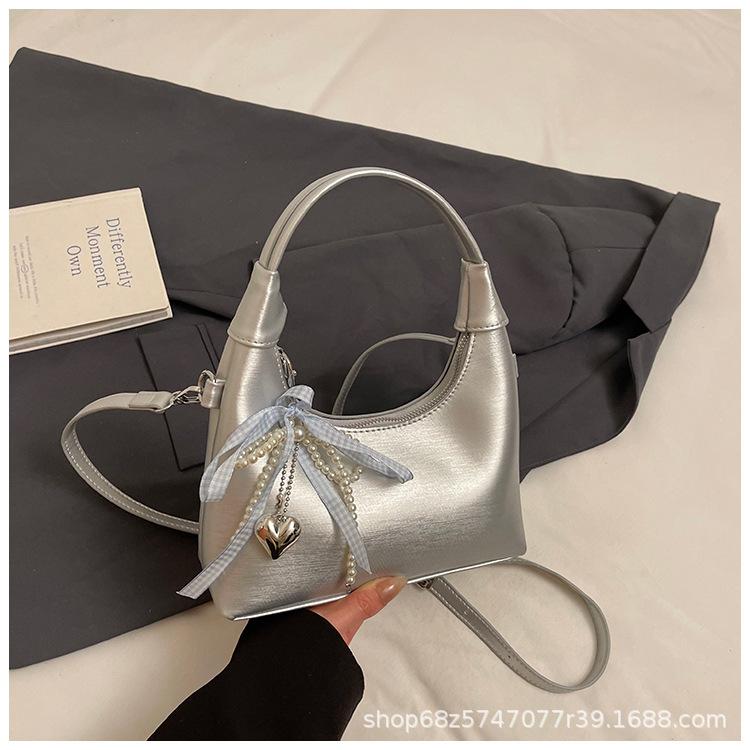 Foreign style bow hand bag women's 2025 new Korean version ins messenger bag fashionable commuter shoulder bag