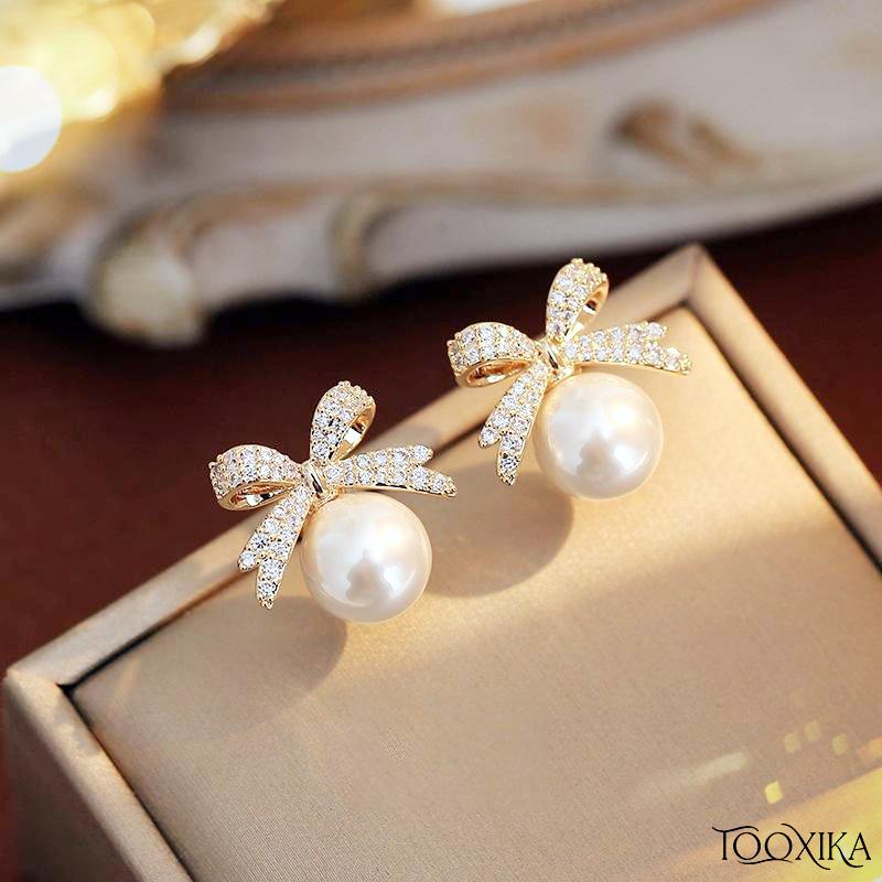 

Японские и корейские изысканные женские серьги с жемчугом и бантиком, модные, простые, компактные и универсальные серебряные серьги-иглы.