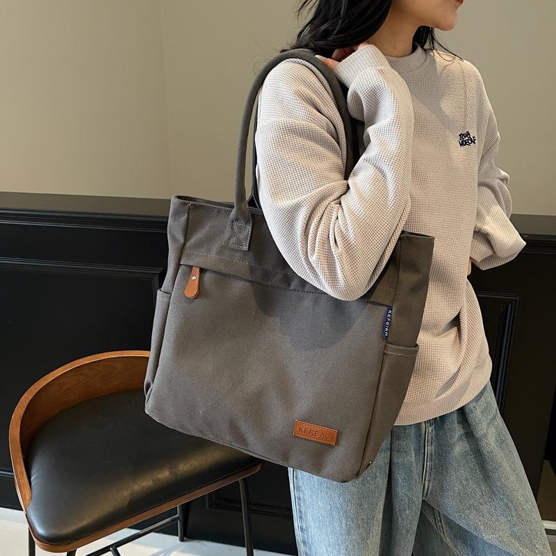 Casual large-capacity canvas bag women's new fashion commuter versatile shoulder bag college student tote bag