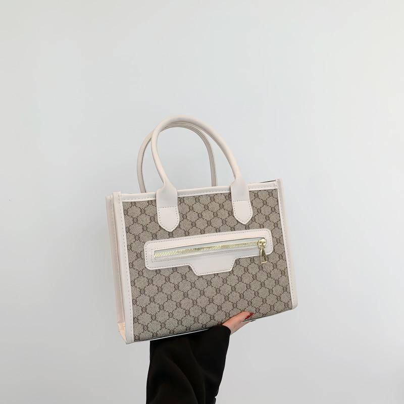 

Сшитая из премиальной текстурной сумки 2025 весна и лето новая ретро рабочая сумка-мессенджер на плечо подмышку сумка-тоут женская