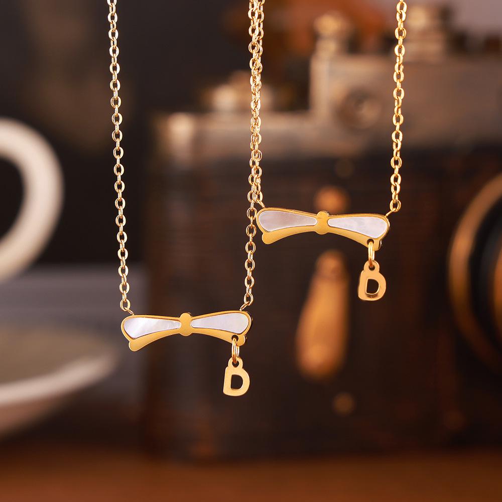 

Elegant Gold-Plated Titanium Steel Necklace with French Retro Bow Pendant