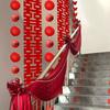 Elegant Stair Handrail Decorations: Gauze Curtains, Red Banners, Lanterns, and Flowers for Wedding Halls